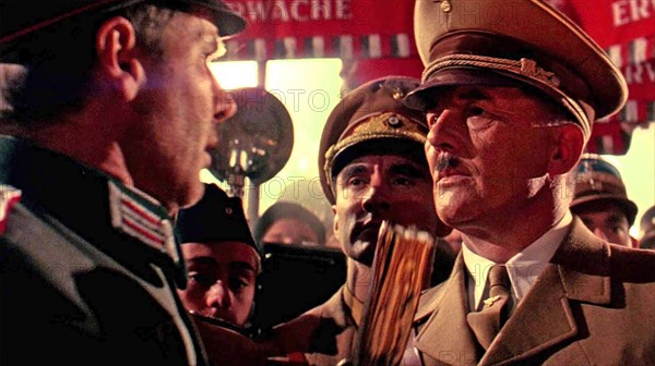 INDIANA JONES AND THE LAST CRUSADE 1989 Paramount Pictures film with Harrison Ford at left and Michael Sheard as Adolf Hitler