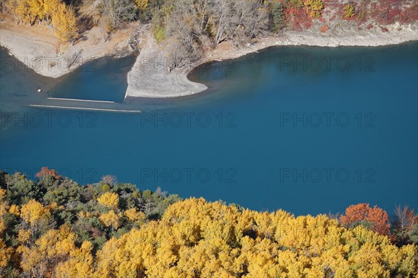 view of the old stone roadway submerged on a fall day in Serre Ponçon lake, France