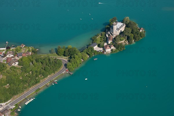 DUINGT CASTLE (aerial view). Medieval castle on a peninsula in the turquoise waters of Lake Annecy. Haute-Savoie, France.
