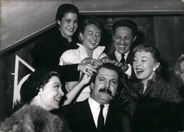 Mar. 03, 1954 - Have a Shampoo?: Georges Brassens, famous 'Realistic' singer being given ''Shampoo'' by three charming singers (from left to right) Arlette Sauvage, Leila Farida, Dick Micheyl, Jean Sablon (The crooner) and Dominious Wills. Picture taken in a Paris music hall where Dick Micheyl presented six new songs.