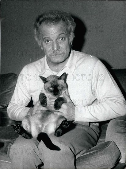 Nov. 02, 1981 - A shy man with a gentle heart and a love for animals, Georges Brassens, has died. He left us his poems and songs, the reminder to love one another. He is being buried next to his parents. Here he is with his cat, Kikou, in his Paris apartment.
