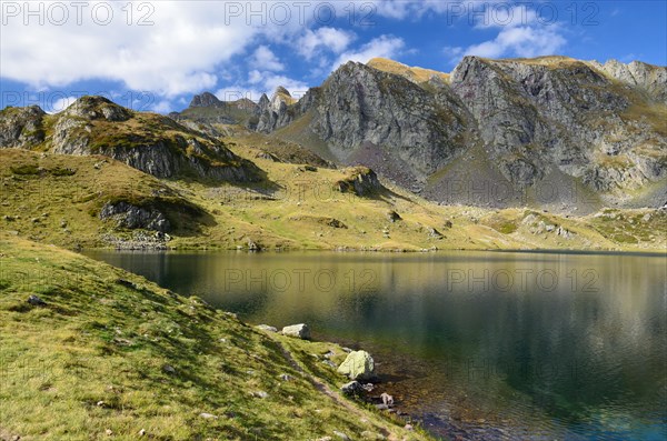 Alpine mountain lake Gentau under the peak Larry