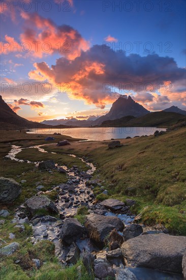 ayous sunrise in lac gentau with midi d ossau in the background