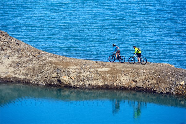 Mountain biking around Alp lake Lac du Mont Cenis, France, Savoie