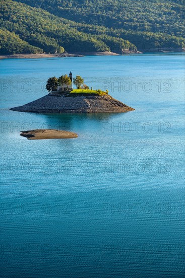 The Saint Michel Chapel and Serre Poncon lake. Saint Michel Bay, Hautes Alpes, Southern French Alps, France