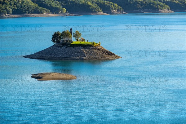 Saint-Michel Chapel and Serre-Poncon Lake in summer. Saint-Michel Bay, Hautes-Alpes, PACA Region, Southern French Alps, France