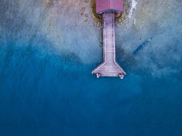 beautiful aerial landscape of the lake Annecy with top view of wooden pier, France