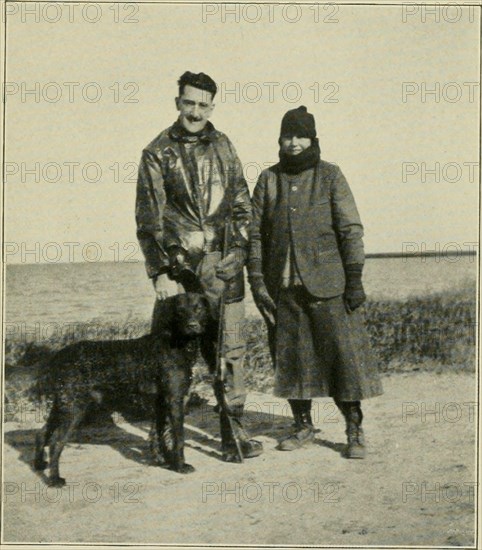 . Ducking days : narratives of duck hunting, studies of wildfowl life, and reminiscences of famous marksmen on the marshes and at the traps. Waterfowl shooting; Waterfowl. JOSEPH PULITZER. JR.. AND MRS. PULITZER, St. Louis, Mo. At Rockport, Texas.. Please note that these images are extracted from scanned page images that may have been digitally enhanced for readability - coloration and appearance of these illustrations may not perfectly resemble the original work.. Morss, Charles B; Hazelton, William Chester, 1870-. Chicago : [W. C. Hazelton]