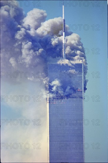 World Trade Center Attack photos taken from 14 street on a rooftop as the towers burn.