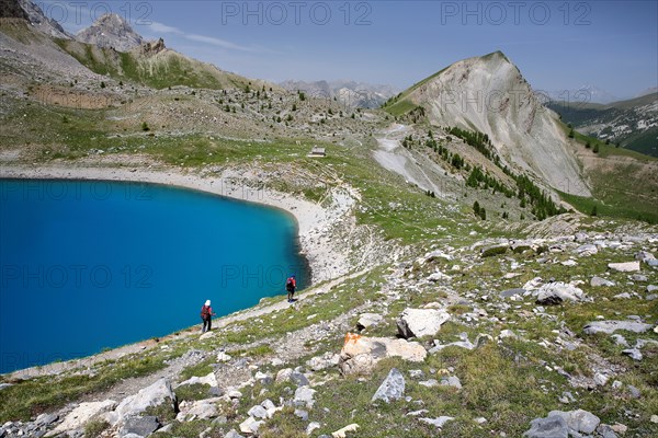 Sainte Anne lake located above Ceillac village after two hours hike, with mountain range, Queyras Regional Natural Park, Southern Alps, France