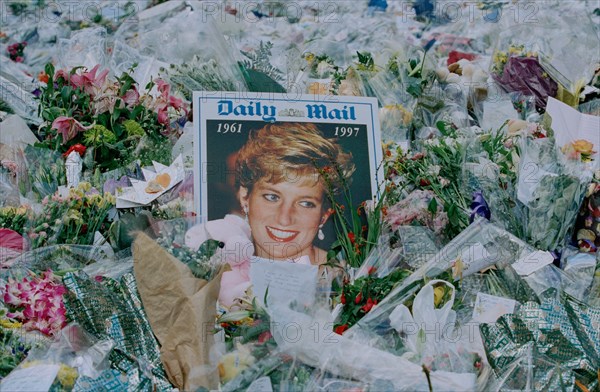 Flowers and mourners outside Kensington Palace in the days following the funeral of Princess Diana, in London, England, September 1997.