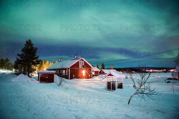 Northern Lights (aurora borealis) over Akaslompolo, a small town in Finnish Lapland, inside Arctic Circle in Finland