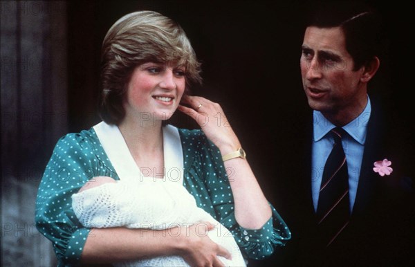 Diana, Princess of Wales, wearing her favourite maternity dress, with newly-born baby Prince William and the Prince Charles, Prince of Wales in June 1982.