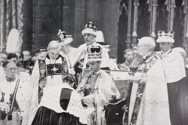 King George VI receives the homage of princes and peers following his coronation in 1937.