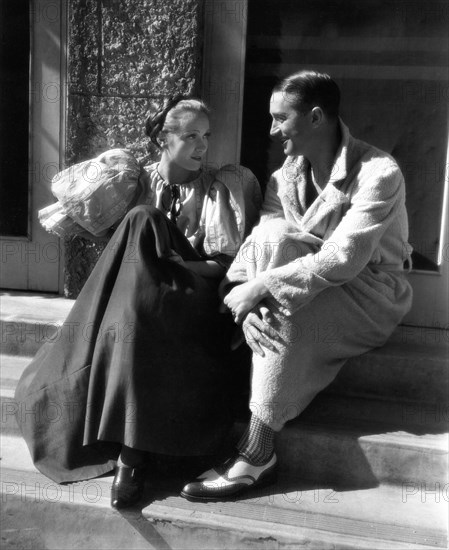 MARLENE DIETRICH in costume with MAURICE CHEVALIER outside Paramount Studios Soundstage during filming of THE SONG OF SONGS 1933 director ROUBEN MAMOULIAN novel Hermann Sudermann play Edward Sheldon costumes Travis Banton Paramount Pictures
