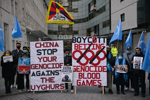 London, UK. 04th Jan, 2022. Activists hold placards expressing their opinion during the No Beijing 2022 protest.Supporters of Tibet, Hongkong, Uyghurs and Anti-CCP activists gathered opposite BBC Broadcasting House in London to call out BBC to boycott Beijing 2022 Olympic Games. Credit: SOPA Images Limited/Alamy Live News