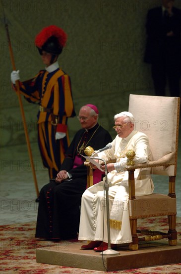 (dpa) - Pope Benedict XVI sits in his chair as he welcomes pilgrims in the audience chamber at the Vatican in Rome, Italy, Monday, 25 April 2005. The Pope welcomed several thousand German pilgrims to the audience who also attended his inauguration yesterday, Sunday, 24 April 2005.