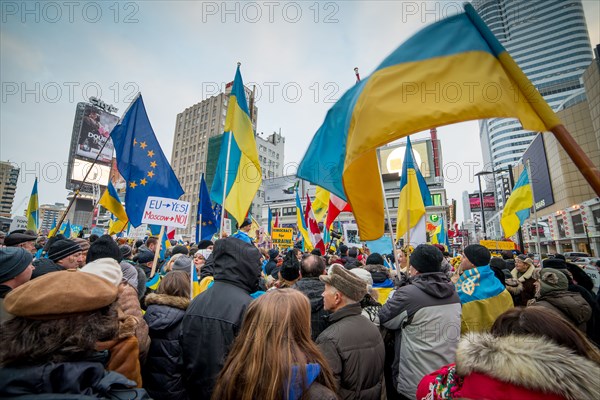 TORONTO - DECEMBER 15: Hundreds gather to protest for Ukraine on December 15, 2013 at Yonge - Dundas Square in Toronto, Canada.