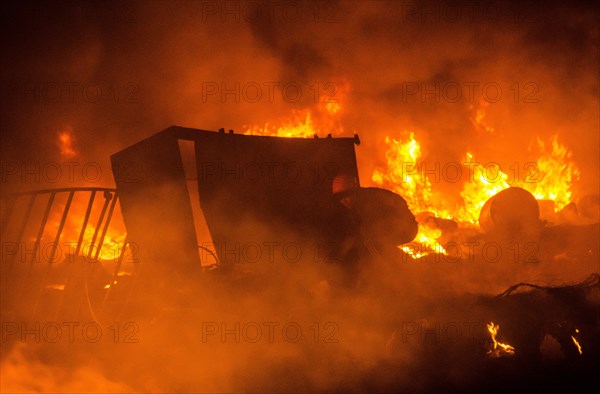 Feb. 19, 2014 - Kiev, Ukraine- February 20, 2014: A barricade is created by protesters made of burning objects. More than 10,000 protesters in Independence Square, Kiev. Regardless of the stage declared truce between police and activists, the people continue to throw molotov cocktails at law enforcement officers. Security forces responded with stun grenades. (Credit Image: © Stas Kozlyuk/NurPhoto/ZUMAPRESS.com)