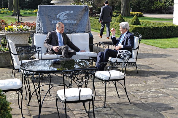US Secretary of State John Kerry and Russian Foreign Minister Sergey Lavrov hold a brief one-on-one conversation on the patio at Winfield House before the start of a formal bilateral discussion focused on Russian intervention in Crimea at the Winfield House March 14, 2014, in London, UK.