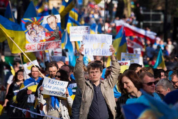 London, UK. 16th March 2014. Over a thousand mainly Ukrainians and their supporters march to the Russian Embassy, protesting against Putin's  "imperialist aggression" as he holds his in/out referendum in the Crimea. Credit:  Paul Davey/Alamy Live News