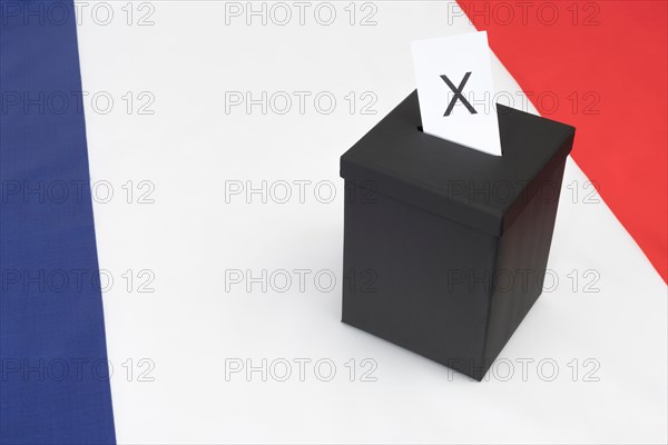 Small black box on French tricolor flag - as visual metaphor for the 2017 French General Election.