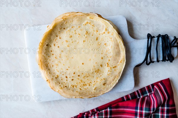 Large Stack of Plain Thin Pancake Crepes for Breakfast.