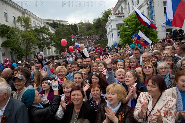 Sevastopol, Crimeans are viewing of the columns of the Parade of Winners on the Nakhimov Avenue of Sevastopol city, Crimea Republic 9 of May, 2014