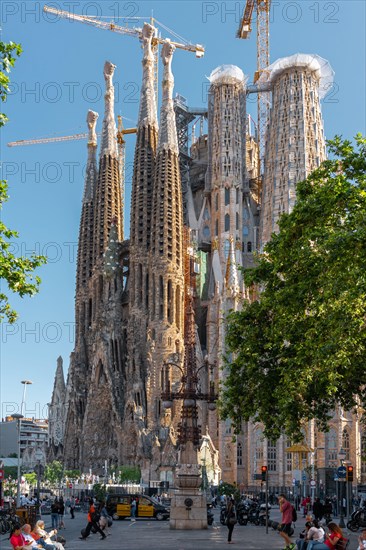 BARCELONA, SPAIN - JUNE 07, 2019: People and tourists enjoying everyday life in downtown Barcelona city, near Sagrada Familia