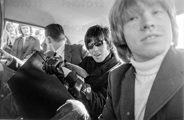 STOCKHOLM 1965 Keith Richards, middle, and Brian Jones, right, of the rock group the Rolling Stones in a car after arriving at Bromma Airport in Stockholm 1965. Photo: Björn Larsson Ask / SE/ TT / Kod: 3020