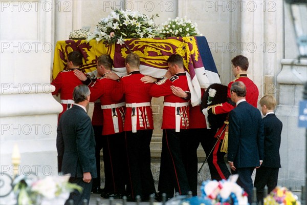The coffin of the Princess of Wales is carried into Westminster Abbey, followed by the Prince of Wales and Prince Harry.