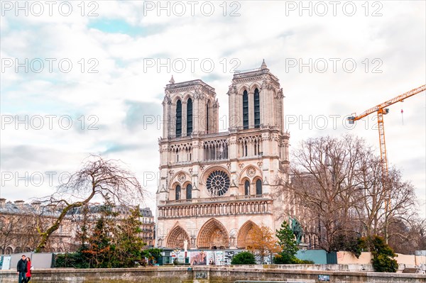 Paris, France - January 20, 2022: The Notre Dame de Paris is a medieval Catholic cathedral on the Ile de la Cite (an island in the Seine River), in th