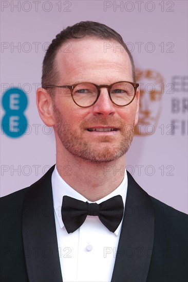 London, UK. 13th Mar, 2022. Joachim Trier on the red carpet for the EE British Academy Film Awards Arrivals on Monday, Mar. 14, 2022 at The Royal Albert Hall . Picture by Credit: Julie Edwards/Alamy Live News