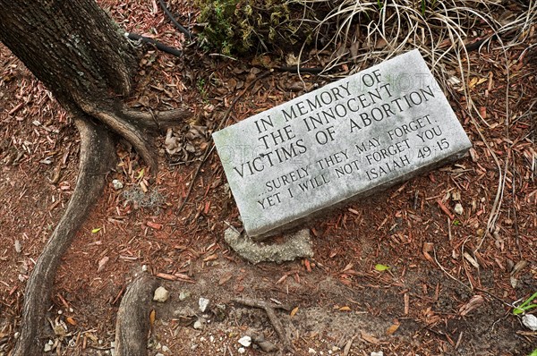 abortion grave marker in garden of church