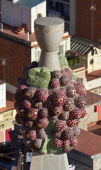 Sagrada Familia Cathedral by Gaudi showing a colourful fruit-inspired pinnacle ressembling a raspberry