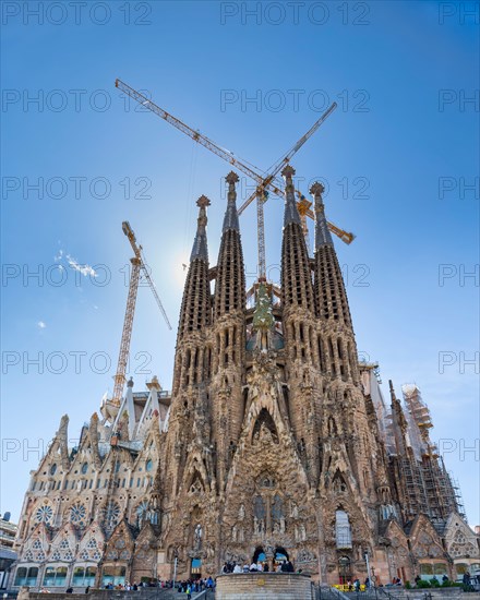 Construction of La Sagrada Familia with cranes forming a cross