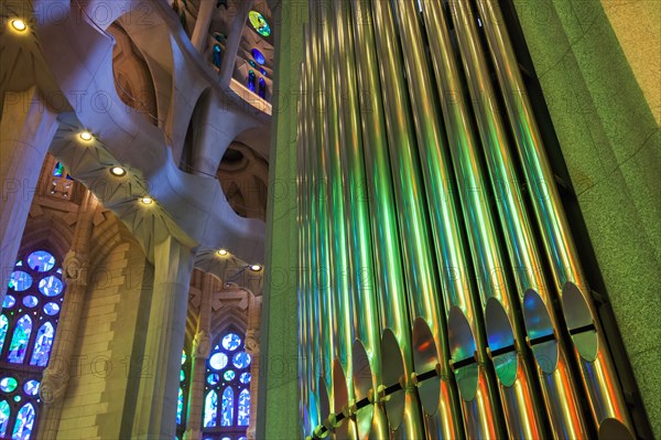 BARCELONA, SPAIN - AUGUST 27, 2014: Colorful interior with organ of La Sagrada Familia - the impressive cathedral designed by An