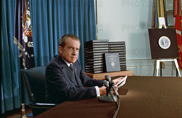 PRESIDENT RICHARD NIXON (1913-1994) with his edited transcripts of the White House Tapes subpoenaed by the Special Prosecutor, during his televised speech  on Watergate  on 29 April 1974. Photo: White House official