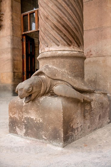 Barcelona, Spain - October 30, 2010: Detail of turtle statue decorating a column on Sagrada Familia nativity facade.