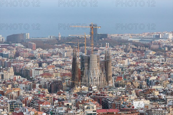 Barcelona, Spain - March 27, 2018: Beautiful panorama view of Barcelona city with famous Sagrada Familia church at sunset, Spain