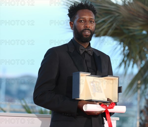 Cannes, France. 25th May, 2019. CANNES, FRANCE - MAY 25: Director Ladj Ly, winner of the Jury Price award for his film "Les Miserables" poses at the photocall for Palme D'Or Winner during the 72nd Cannes Film Festival ( Credit: Mickael Chavet/Alamy Live News