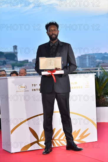 CANNES, FRANCE. May 25, 2019: Ladj Ly at the Palme d'Or Awards photocall at the 72nd Festival de Cannes.Picture: Paul Smith / Featureflash