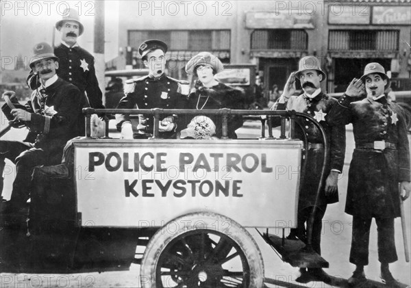 Keystone Cops, Tillie's Punctured Romance still from the 1914 Mack Sennett first full length silent movie with the iconic incompetent police and starring Mabel Normand and Charlie Chaplin