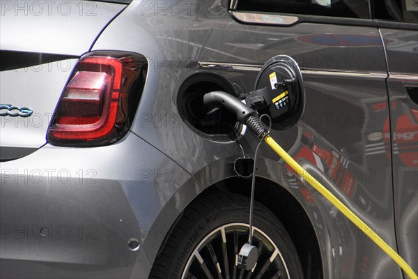 Marseille, France. 9th May, 2021. A close-up of an electric car recharging its batteries in ''rue de la loge'' Marseille.According to a study, price parity between gasoline-powered and battery-powered cars could be reached as early as 2026. The price curve could even reverse in 2030. Credit: Gerard Bottino/SOPA Images/ZUMA Wire/Alamy Live News