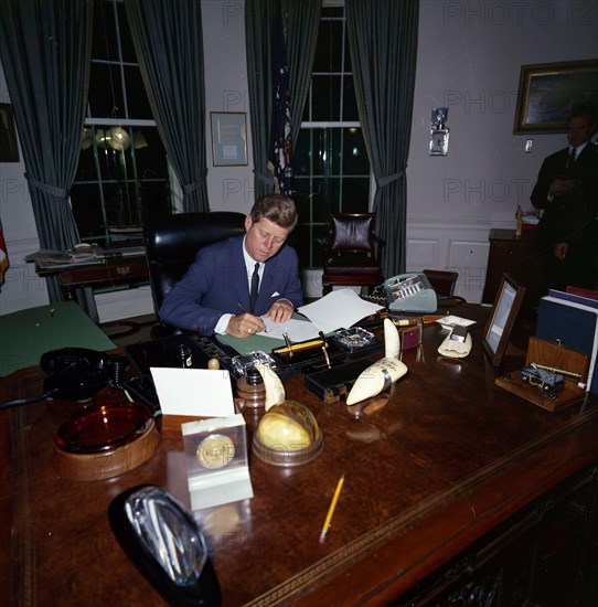 23 October 1962
President John F. Kennedy signing the Cuba quarantine proclamation in the Oval Office.

Please credit "Robert Knudsen. White House Photographs. John F. Kennedy Presidential Library and Museum, Boston"