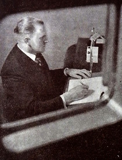 A very early printed photograph of a BBC announcer reading the news .   The BBC began  daily radio services in London  in the 1920s on the radio station 2LO. Under the general management of 33 year old John Charles Walsham Reith  the BBC  began to expand its programmes on 14 December 1922. The  first chief engineer was Peter Eckersley. 1927 saw the establishment of British Broadcasting Corporation  by Royal Charter with  Reith as its first Director-General.  John Logie Baird began experimenting  with television broadcasts on BBC frequencies in November 1929.