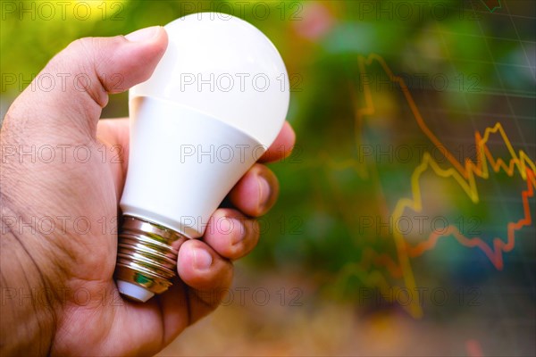 Brazil. 17th Aug, 2021. In this photo illustration a hand holding a LED light bulb (light-emitting diodes). Electricity price concept, readjustment in the electricity bill. Credit: SOPA Images Limited/Alamy Live News