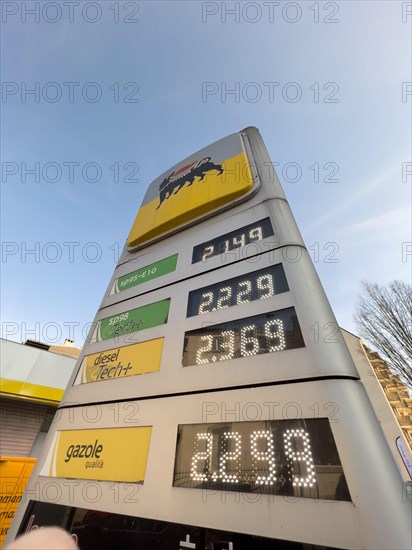 Strasbourg, France - Mar 11 2022: View from below of Italian Eni gas station with new prices at the pump exceeding all expectations. The war in Ukraine has pushed fuel prices above the two-euro threshold for first time.