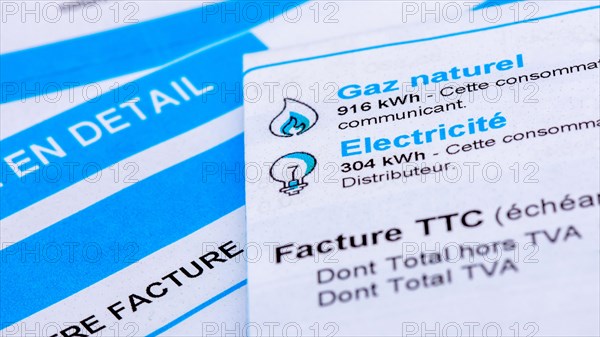 Rise of energy prices in France: close-up of a French invoice with details of the natural gas and electricity consumptions to be paid measured in kWh