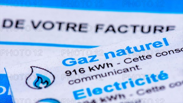 Rise of energy prices in France: close-up of a French invoice with details of the natural gas and electricity consumptions to be paid measured in kWh